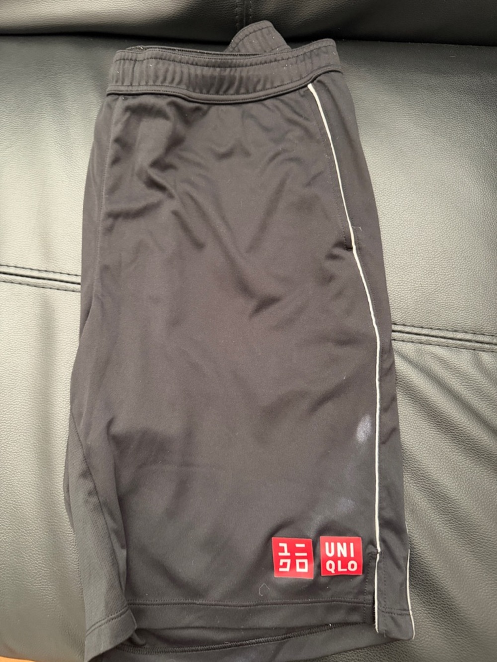 UNIQLO Black Athletic Shorts with White Piping and Red Logo